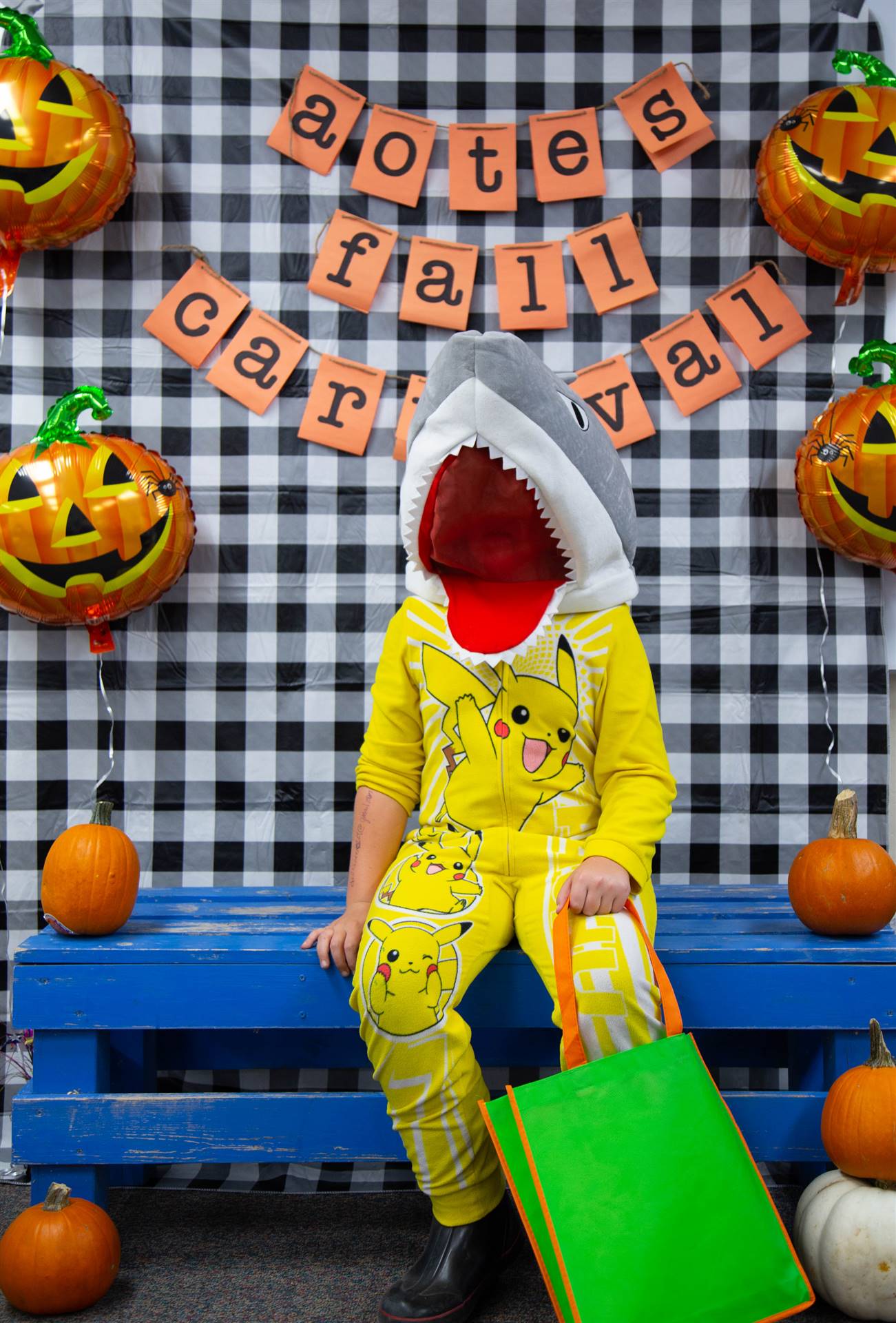 a boy in a shark costume 