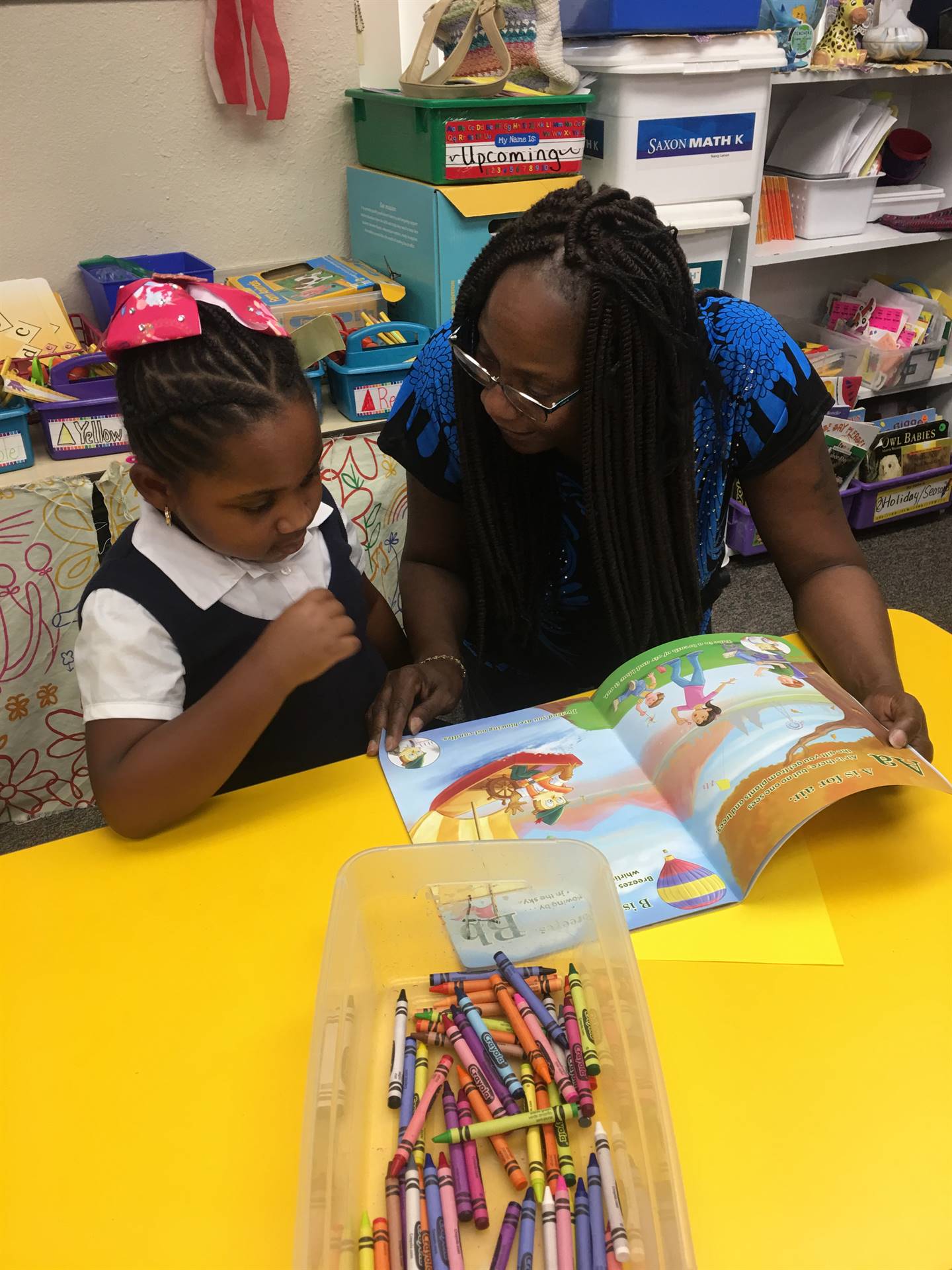 student shares a story with her grandparent 